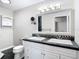 Bathroom with double vanity and a shower at 37525 Moore Dr, Dade City, FL 33525