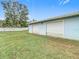 Detached two-car garage with metal roll-up doors at 37525 Moore Dr, Dade City, FL 33525