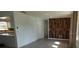 Bright living room with wood-look floors and an accent wall at 39219 5Th Ave, Zephyrhills, FL 33542