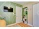 Bedroom with green accent wall and closet at 420 40Th N St, St Petersburg, FL 33713