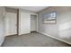 Well lit bedroom with grey carpet and closet at 509 S Everina Cir, Brandon, FL 33510