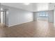 Living room with tile floors and access to balcony at 5108 Brittany S Dr # 506, St Petersburg, FL 33715