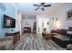 Living room with hardwood floors, sectional sofa, and seating area at 6321 Yellow Buckeye Dr, Riverview, FL 33578