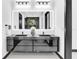 Modern bathroom featuring a floating dual vanity, a large mirror, and unique lighting at 6524 6Th N Ave, St Petersburg, FL 33710
