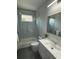 Clean bathroom with tub shower combo and floating vanity at 6524 6Th N Ave, St Petersburg, FL 33710