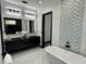 Sleek bathroom featuring a modern vanity with double sinks and a luxurious soaking tub with tile accents at 6524 6Th N Ave, St Petersburg, FL 33710