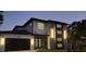 Modern two-story house with a dark gray garage door, and sleek design at 6524 6Th N Ave, St Petersburg, FL 33710