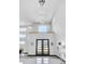 Bright, light-filled foyer with double doors, high ceilings, and a stunning chandelier at 6524 6Th N Ave, St Petersburg, FL 33710