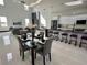Bright, modern kitchen featuring a black marble island, sleek white cabinets, and stainless steel appliances at 6524 6Th N Ave, St Petersburg, FL 33710