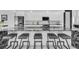 Modern kitchen featuring granite countertops, bar stool seating, and stainless steel appliances at 6524 6Th N Ave, St Petersburg, FL 33710