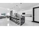Spacious kitchen featuring black marble waterfall island and modern bar stool seating at 6524 6Th N Ave, St Petersburg, FL 33710