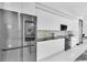 Modern kitchen with sleek cabinetry, stainless steel appliances, and granite countertops at 6524 6Th N Ave, St Petersburg, FL 33710