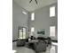 Bright living room with high ceilings, natural light, and gray seating arrangement at 6524 6Th N Ave, St Petersburg, FL 33710