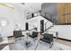 Elegant living area with high ceilings, stairs to second floor and sleek modern design at 6524 6Th N Ave, St Petersburg, FL 33710