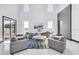 Bright living room with high ceilings, ample natural light, and stylish contemporary furnishings at 6524 6Th N Ave, St Petersburg, FL 33710
