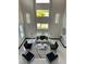 Bright living room boasts soaring ceilings, modern lighting, and a chic seating arrangement at 6524 6Th N Ave, St Petersburg, FL 33710