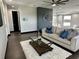 Living area featuring a plush sofa, elegant coffee table, and contemporary decor at 6524 6Th N Ave, St Petersburg, FL 33710