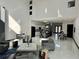 Spacious open-concept living area with high ceilings and modern finishes, blending living, dining, and kitchen spaces at 6524 6Th N Ave, St Petersburg, FL 33710