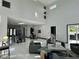 Bright and open living space with high ceilings, connecting living, dining, and kitchen areas at 6524 6Th N Ave, St Petersburg, FL 33710