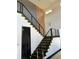Modern staircase features metal railings, sleek design, and access to upper level at 6524 6Th N Ave, St Petersburg, FL 33710