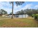 Backyard view of detached garage and attached carport at 6602 S Emerson Ave, St Petersburg, FL 33707