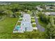 Aerial view of neighborhood modern homes with pools in a lush green area at 7602 Antilla St, Tampa, FL 33625