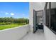Balcony with expansive views of the natural landscape, accessible from bedroom at 7602 Antilla St, Tampa, FL 33625