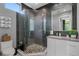 Sleek bathroom design with glass shower, modern fixtures, and minimalist white vanity at 7602 Antilla St, Tampa, FL 33625