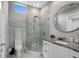 Modern bathroom with a glass-enclosed shower, stylish vanity, and contemporary fixtures for a luxurious experience at 7602 Antilla St, Tampa, FL 33625