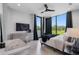 Contemporary bedroom with large windows, sleek furniture, and a relaxing ambiance at 7602 Antilla St, Tampa, FL 33625