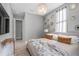 Serene bedroom with soft lighting, decorative mirrors, and a comfortable bed with plush pillows at 7602 Antilla St, Tampa, FL 33625