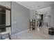 Minimalist room with a window, stairs, and neutral tones creates a calm, inviting space with ample natural light at 7602 Antilla St, Tampa, FL 33625