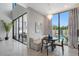 Bright breakfast nook with modern chandelier and views of the sparkling pool area at 7602 Antilla St, Tampa, FL 33625