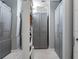 Spacious walk-in closet featuring custom shelving, ample storage, and mirrors, providing an organized dressing area at 7602 Antilla St, Tampa, FL 33625