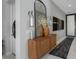 Tastefully decorated entryway featuring a wooden console table, ornate mirror, and stylish decor, creating a welcoming ambiance at 7602 Antilla St, Tampa, FL 33625