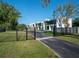 Gated community featuring modern homes with sleek designs, lush landscaping, and a secure, private entrance at 7602 Antilla St, Tampa, FL 33625
