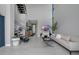 Bright living room with staircase, neutral tones, and view to entry way at 7602 Antilla St, Tampa, FL 33625
