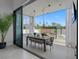 Outdoor dining area next to the pool with a chandelier and outdoor pergola at 7602 Antilla St, Tampa, FL 33625