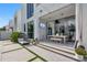 Outdoor patio area with lounge chair, dining area, and outdoor television at 7602 Antilla St, Tampa, FL 33625