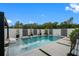 Inviting pool area with stylish decor, lush greenery, and relaxing lounge chairs at 7602 Antilla St, Tampa, FL 33625