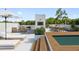 Relaxing rooftop deck area with outdoor seating, dining, a mini-pool, and scenic views for leisure and entertaining at 7602 Antilla St, Tampa, FL 33625