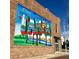 Tampa city mural on a red brick building showcasing local attractions and iconic imagery at 7602 Antilla St, Tampa, FL 33625