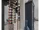 Modern wine rack display adjacent to a stylish cabinet in a contemporary home at 7602 Antilla St, Tampa, FL 33625