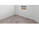 Empty spare bedroom with tile flooring at 8077 Shore Lake Dr, Englewood, FL 34224