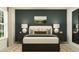 Bedroom with dark green accent wall and neutral decor at 8317 Bella Mar Trl, Parrish, FL 34219