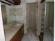 Full bathroom with vanity, sink, shower, and toilet at 8510 Renald Blvd, Temple Terrace, FL 33637