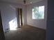 Bedroom with purple walls, carpet, and a closet at 8510 Renald Blvd, Temple Terrace, FL 33637