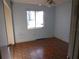 Simple bedroom with light blue walls, tile floor, and a window at 8510 Renald Blvd, Temple Terrace, FL 33637