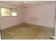 Pink bedroom with carpet flooring and a window at 8510 Renald Blvd, Temple Terrace, FL 33637