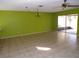 Lime green walls and tile floors in the living room at 8510 Renald Blvd, Temple Terrace, FL 33637